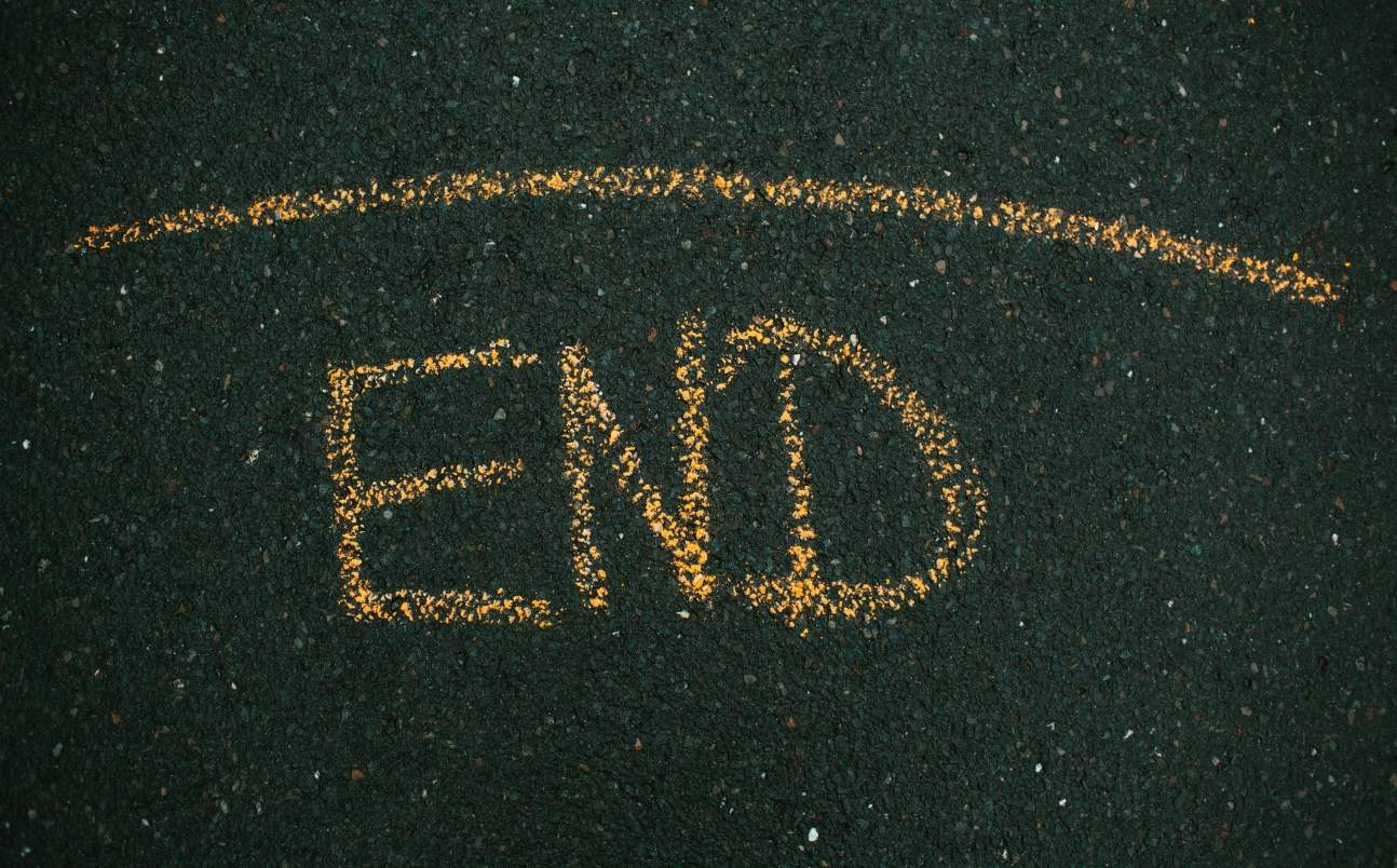 The word END chalked on a pavement